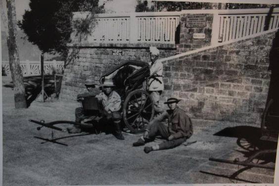 Rickshaw pullers resting. Chowrasta, Darjeeling during the British Raj